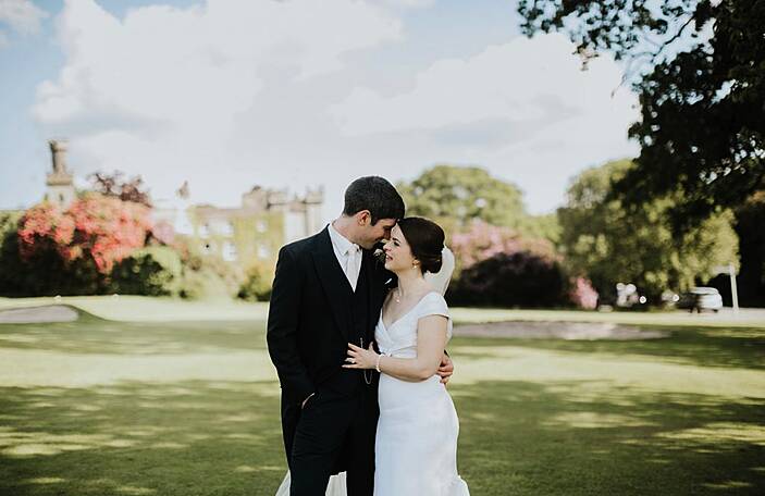 Two worlds collide at Emily and Gerard's Cabra Castle wedding