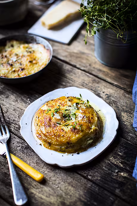 Pommes Anna | DonalSkehan.com, This classic French side dish is made simply by piling up thinly sliced potatoes with lots of butter. Once you'd made this recipe you'll never look at the humble spud quite the same way again!