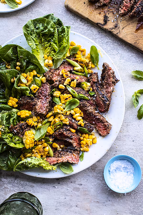 Fire & Smoke Recipes! | DonalSkehan.com, Growing up in Ireland cooking on the BBQ was relegated to the odd summer evening when the weather was decent and we managed to cobble together a feast of some burnt sausages and burgers. These days I find there’s more of a shift to incorporating the grill as an extension of the home kitchen. Heck, in the depths of the February lockdown I cooked on the barbeque outside with an umbrella as a means of distracting myself from losing my mind and the monotony of cooking at home. Perhaps fire & smoke has been the missing ingredient in Ireland’s traditional cooking, particularly as we have access to some of the world’s finest meat, fish and produce on our doorstep. This week I’m sharing some of my favourite simple al fresco recipes that make the most of food cooked over hot coals.<br />
