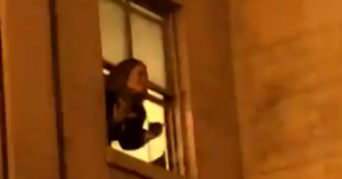 Watch Adele Hangs Out Of Her Hotel Window To Chat To Fans