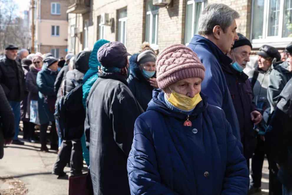 KYIV, UKRAINE - Mar. 15, 2022: War of Russia against Ukraine. Queue for free grocery kits, Kyiv, Ukraine