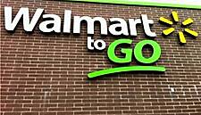 Wal-Mart Cuts Forecast as Pay Raises, Currency Moves Take Toll