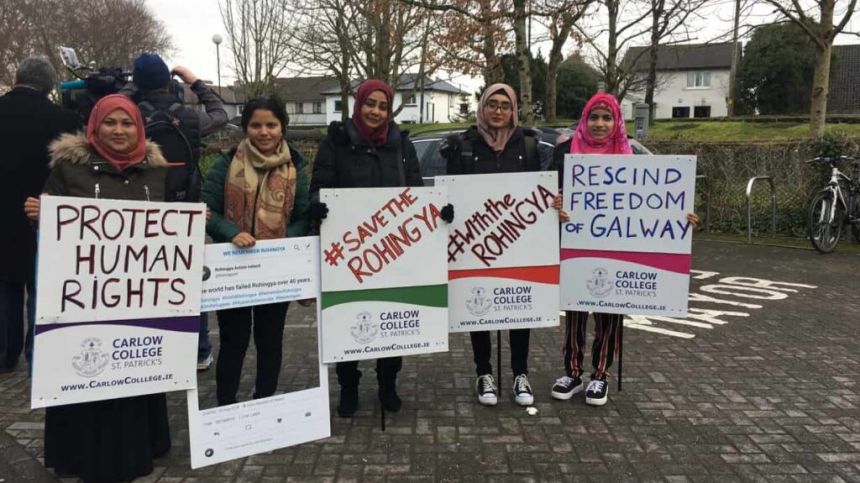 Protestors gather at City Hall in call to revoke honour from Aung San Suu Kyi