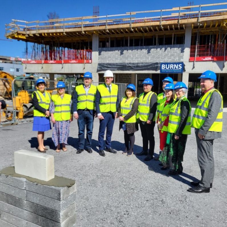 Minister Simon Coveney lays ceremonial block at major new creative innovation hub in city