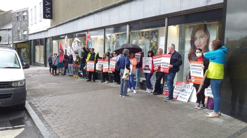 Debenhams workers gather in city to mark 100 days on strike