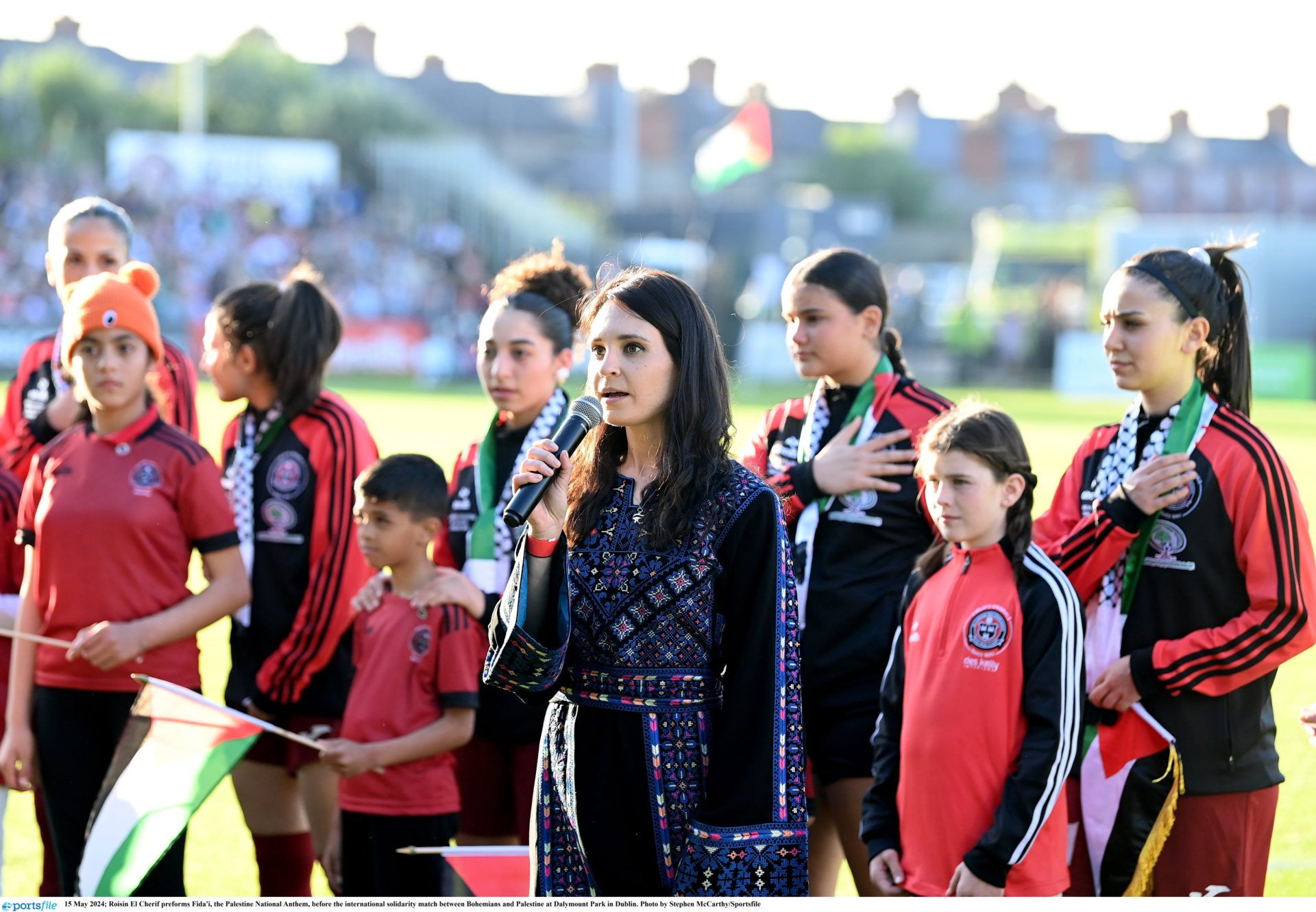 15 May 2024; Roisin El Cherif performs Fida'i, the Palestine National Anthem, before the international solidarity match between Bohemians and Palestine at Dalymount Park in Dublin. Photo by Stephen McCarthy/Sportsfile
