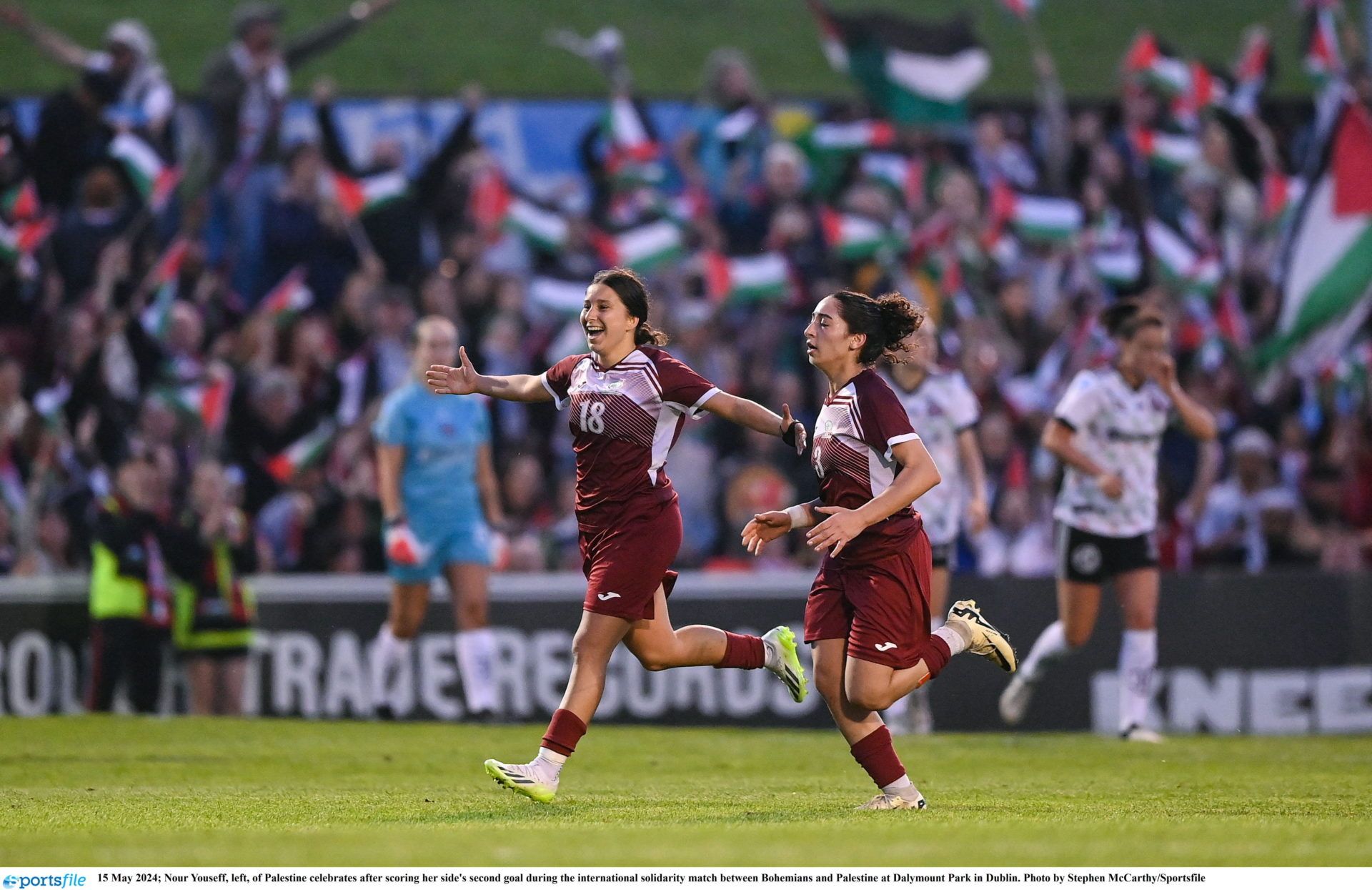 15 May 2024; Nour Youseff, left, of Palestine celebrates after scoring her side's second goal during the international solidarity match between Bohemians and Palestine at Dalymount Park in Dublin. Photo by Stephen McCarthy/Sportsfile