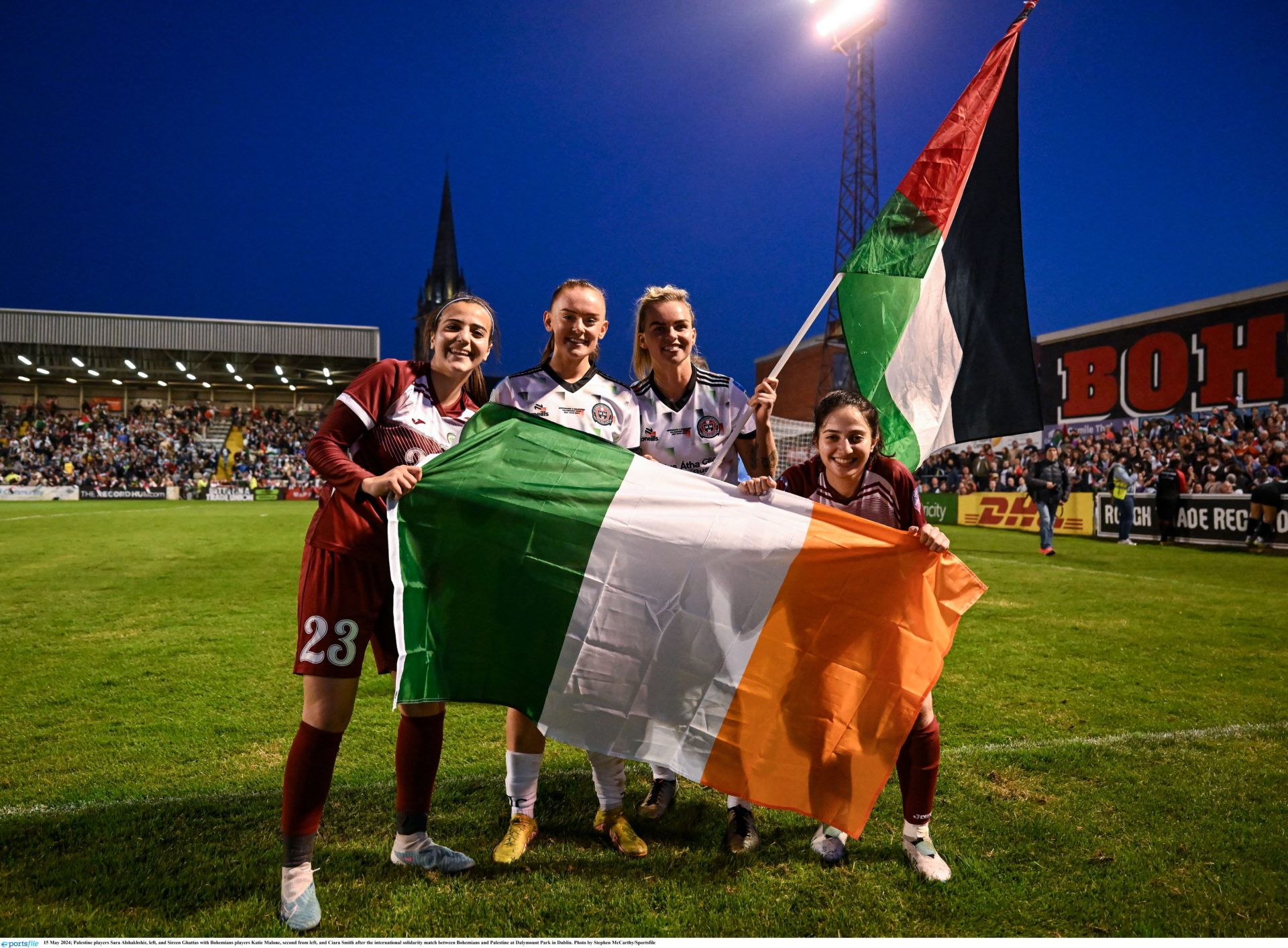 15 May 2024; Palestine players Sara Alshakhshir, left, and Sireen Ghattas with Bohemians players Katie Malone, second from left, and Ciara Smith after the international solidarity match between Bohemians and Palestine at Dalymount Park in Dublin. Photo by Stephen McCarthy/Sportsfile