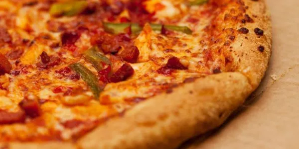 Domino's Pizza Group Unveils £70m Share Buyback