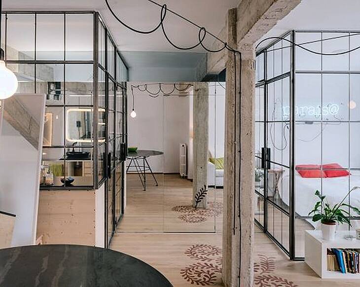 Smoke and mirrors: this small apartment doubles its visual space with one trick