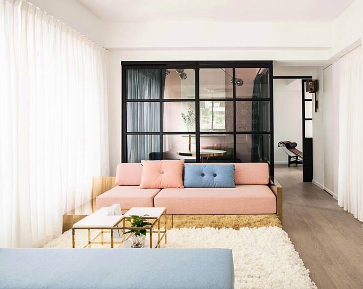 This Hong Kong apartment is a glorious example of how to use muted and dark colours