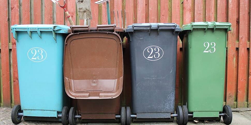 Woman greases up wheelie bin h...