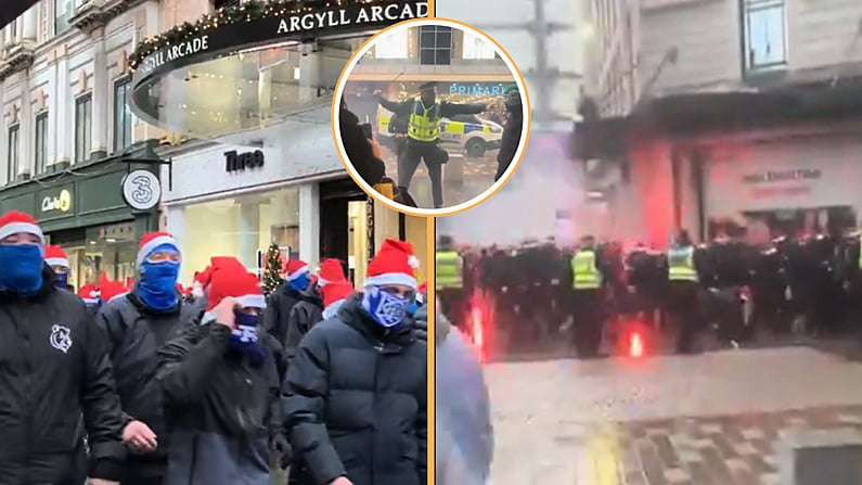 Achrann i nGlaschú Nuair a Thugann Lucht Leanúna i Hataí Daidí na Nollag Aghaidh ar a Chéile Roimh an Dearbaí Old Firm