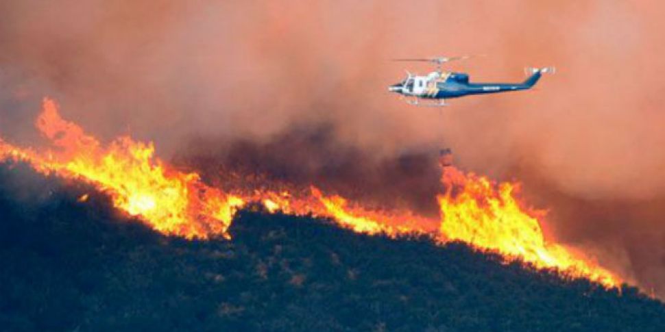 California wildfire triples in...