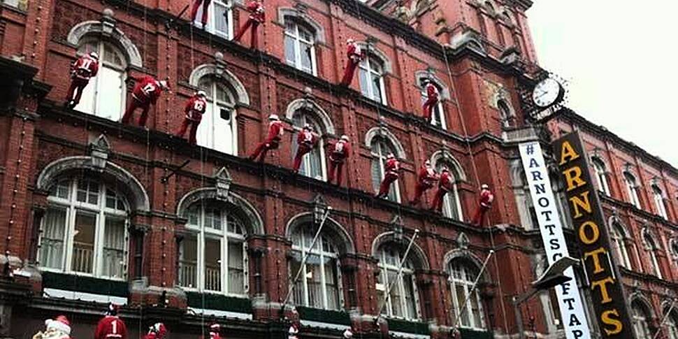 Abseiling Santa gets stuck at...