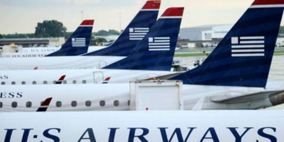 US Airways apologises over por...