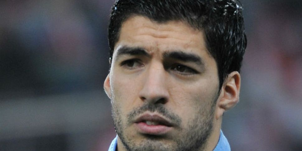 Suarez hit with 9-game and fou...