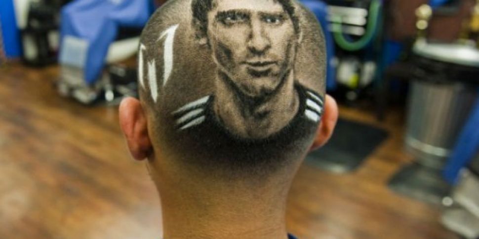 Barber shaves World Cup portra...