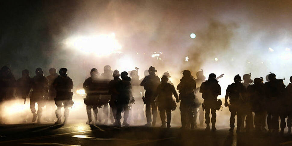 Police use smoke and tear gas...