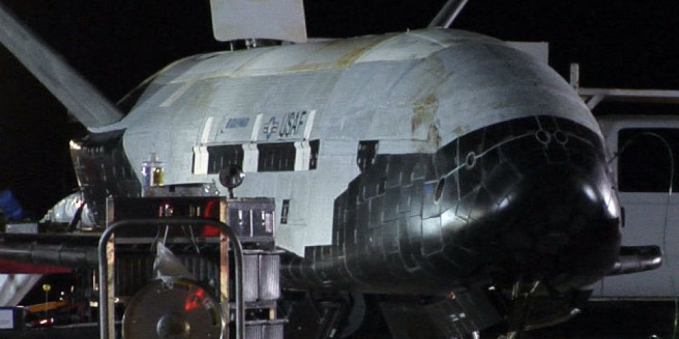 Mystery space plane lands at U...