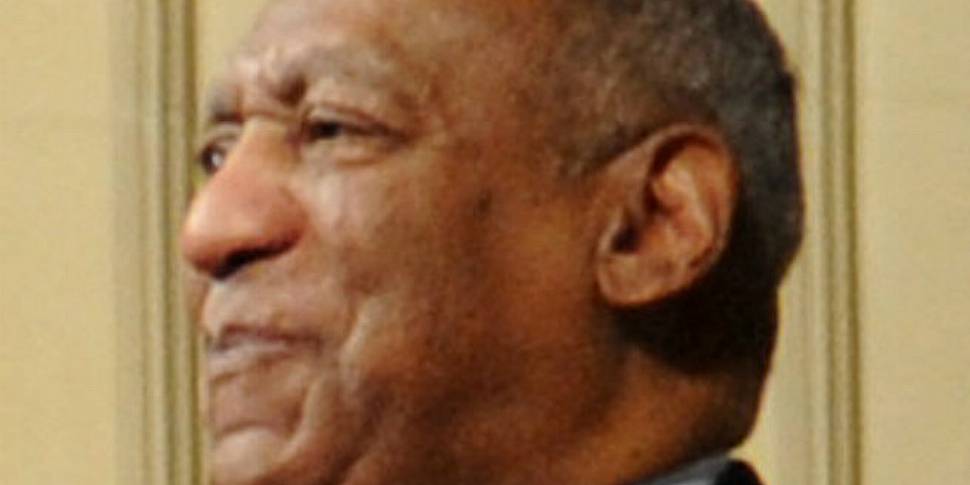 Bill Cosby jokes on stage, tel...