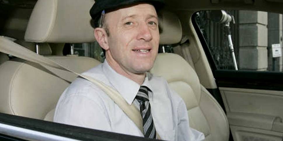 Michael Healy-Rae stands over...