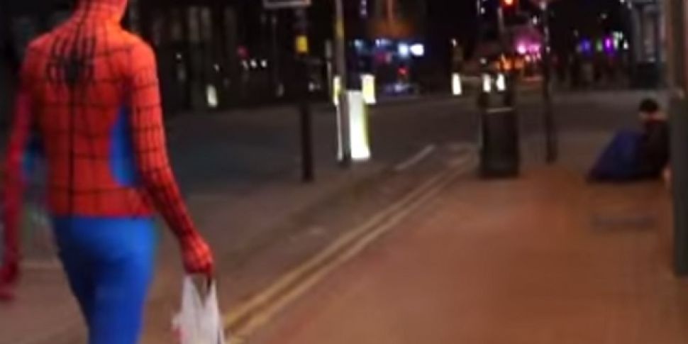 A man dressed as Spider-Man is...