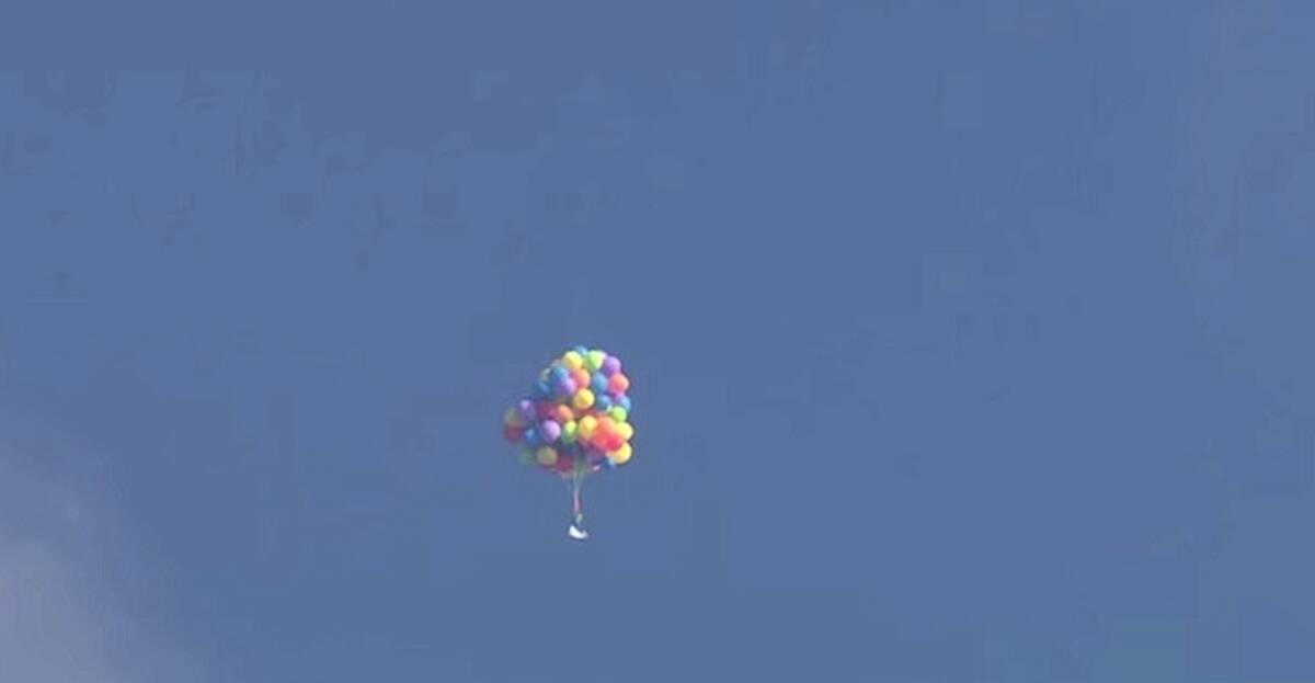 WATCH: Canadian man takes to the skies on chair tied to helium-filled ...