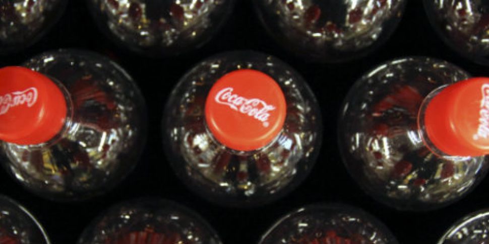 Coca-Cola shares rise after co...