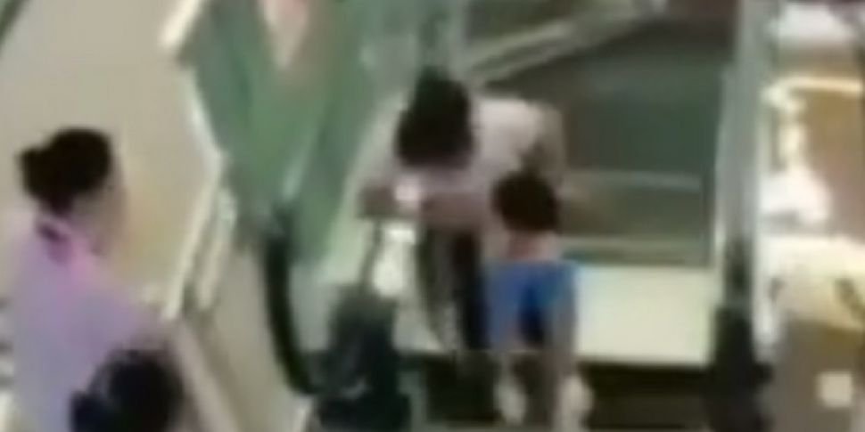 Woman killed in escalator acci...