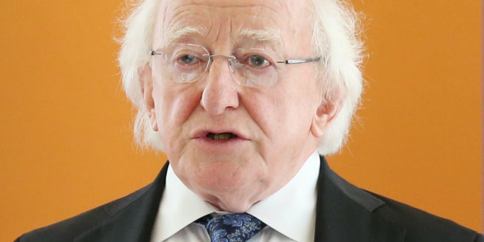 President Higgins signs Intern...