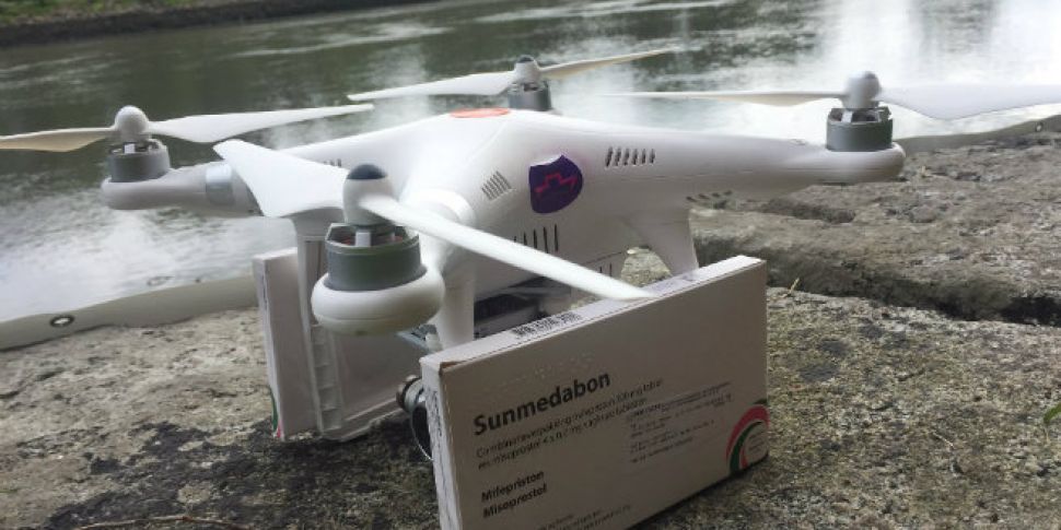 Activists fly drone carrying a...