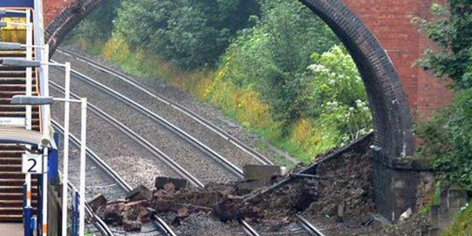 Bridge collapses onto rail tra...