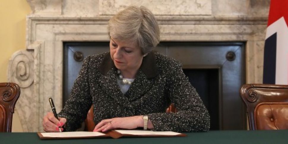 Theresa May signs letter trigg...