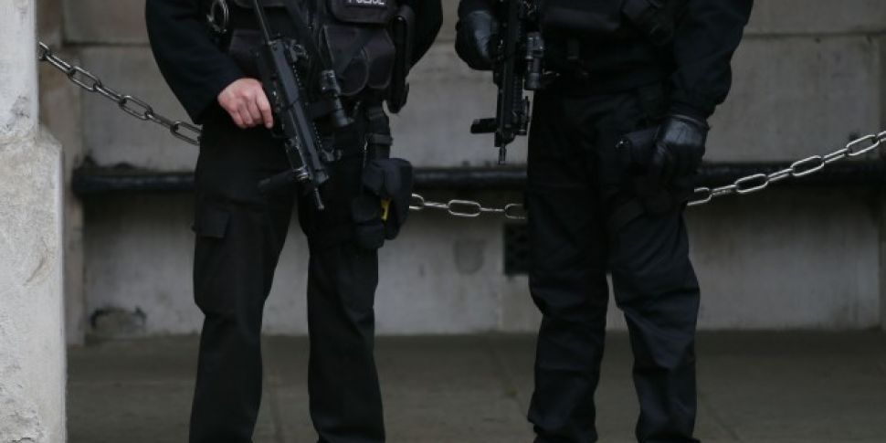 Woman under armed guard in Lon...
