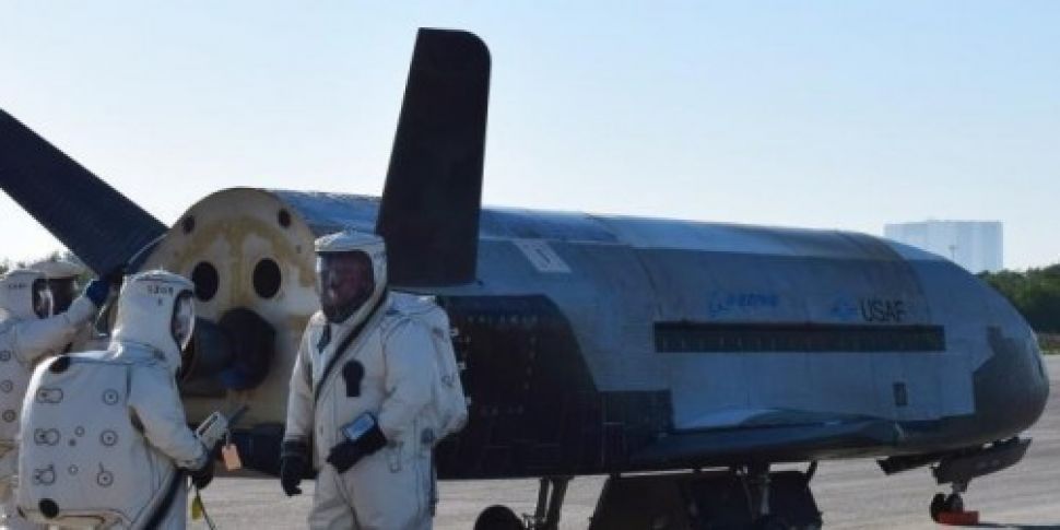 Unmanned space plane lands in...