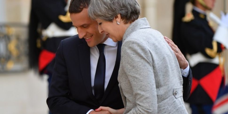 Macron gets cheeky with May as...