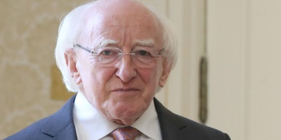 President Higgins signs Irish...