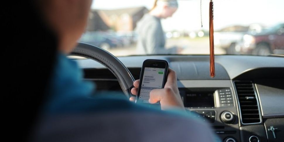 50,000 drivers fined for using...