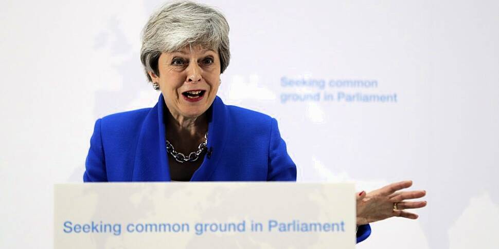 May calls for compromise amid...