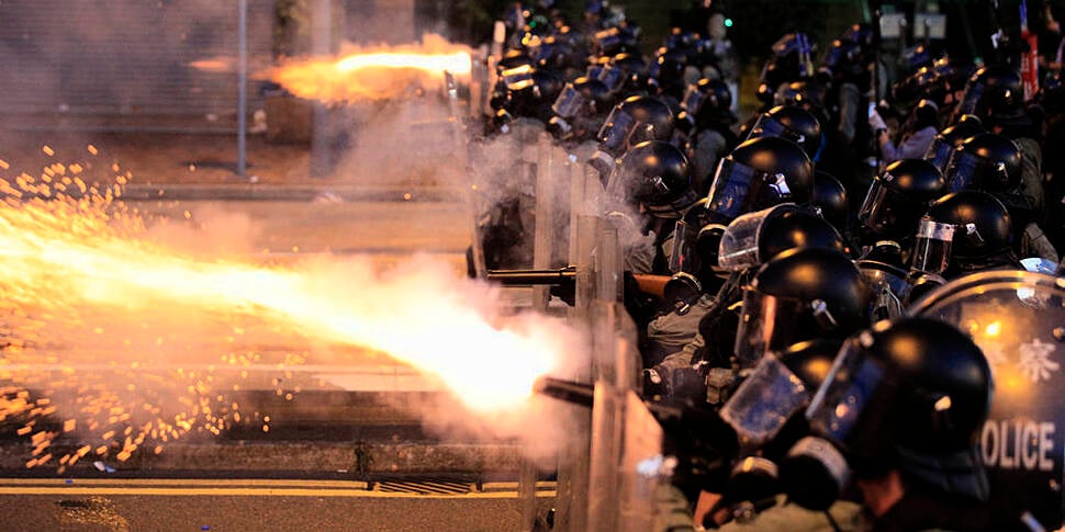 Hong Kong police fire tear gas...