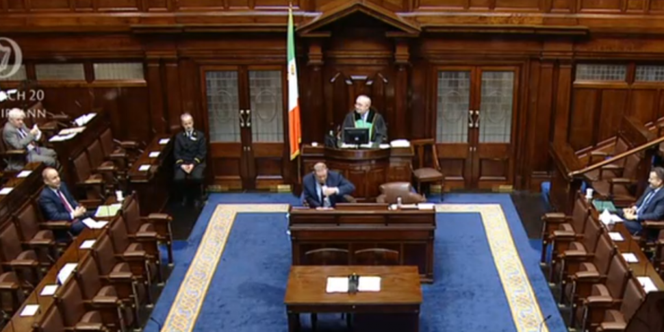Reduced Dáil begins sitting to...