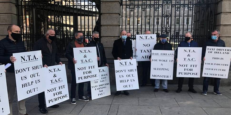 Taxi drivers protest outside D...