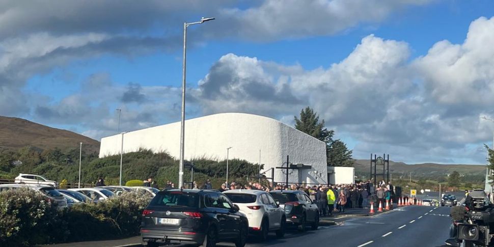 Mourners gather for Hugh Kelly...
