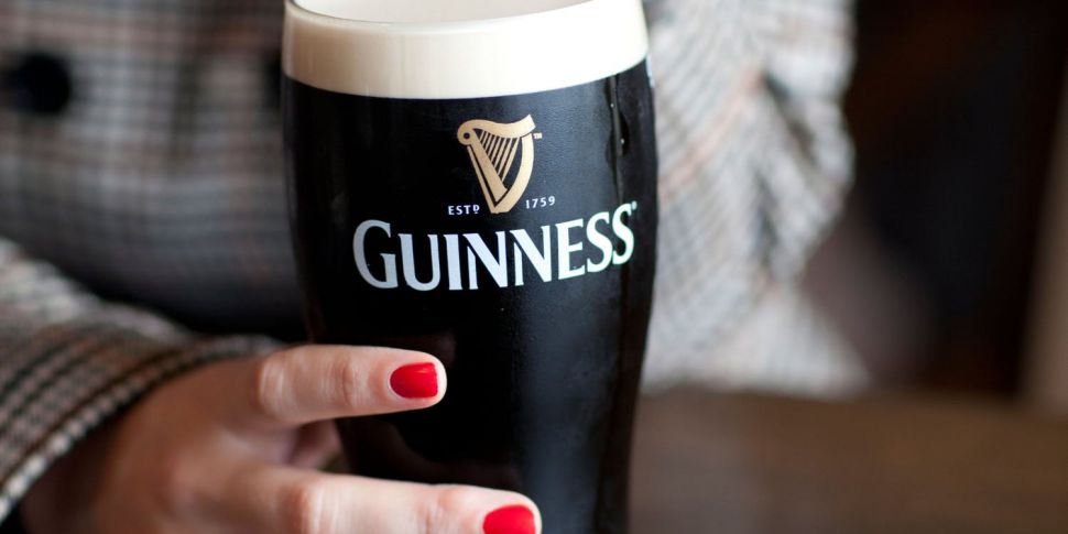 Woman eating Guinness with a s...