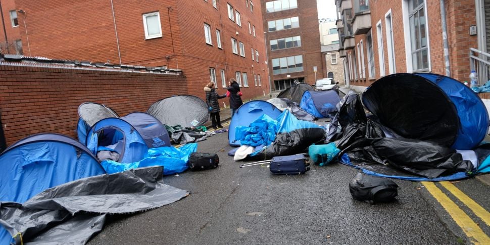 Asylum seekers in tents outsid...