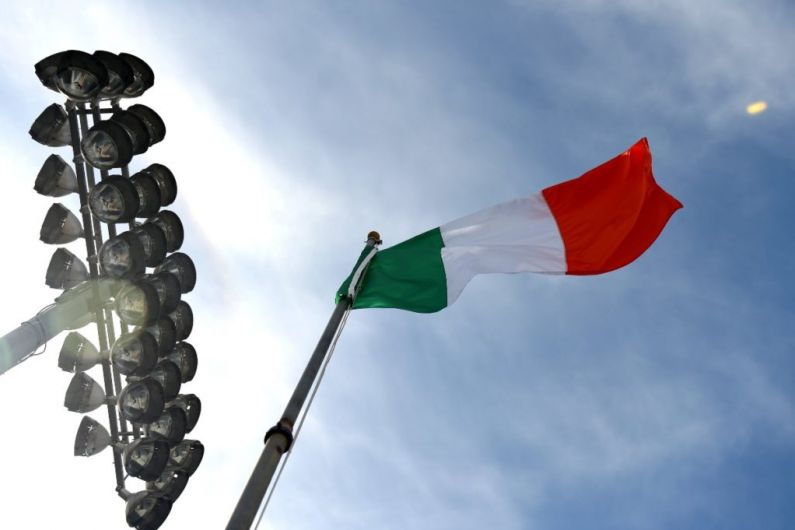 Condemnation over placement of tri-colour over McAuley's coffin