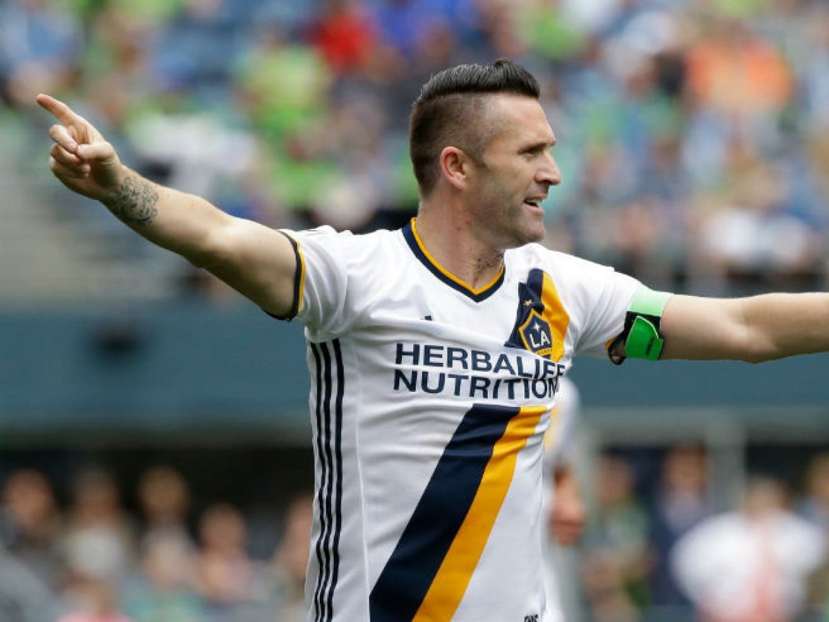Robbie Keane all smiles as he plays ball with David Beckham