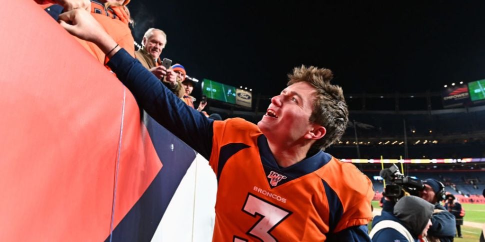 Drew Lock of the Denver Broncos carries the ball ahead of Derrick