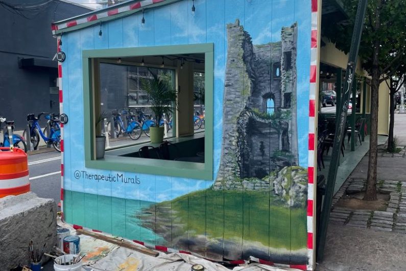 Mural of Fenit Castle being painted on Brooklyn bar